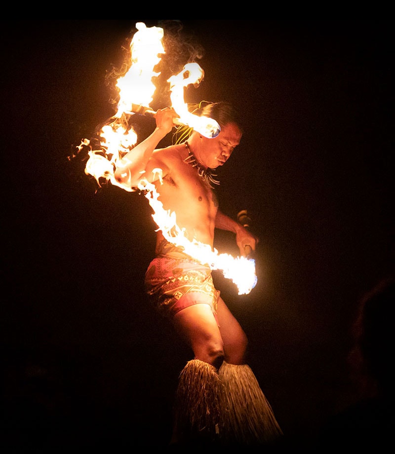 compare Kauai luaus fire dancers
